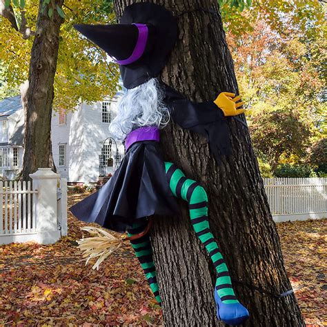 Impressive Halloween Display: Witch Crashing into a Spooky Tree Decoration